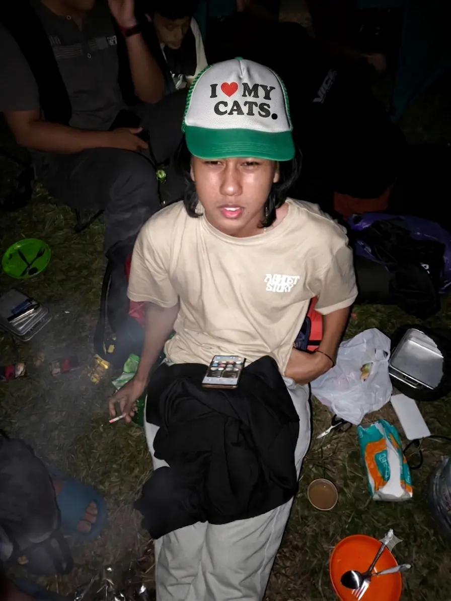 Azril camping at Bukit Klangon in an I love my cats cap